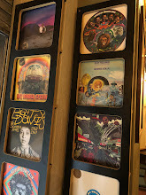 Vinyl record sleeves lining the wall inside Marlowe's Way laneway café